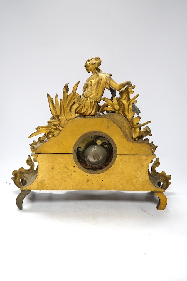 A Louis XV style gilt bronze mantel clock, 41cm wide, 35cm high. Condition - one replacement foot, fair but very dusty, not tested as working